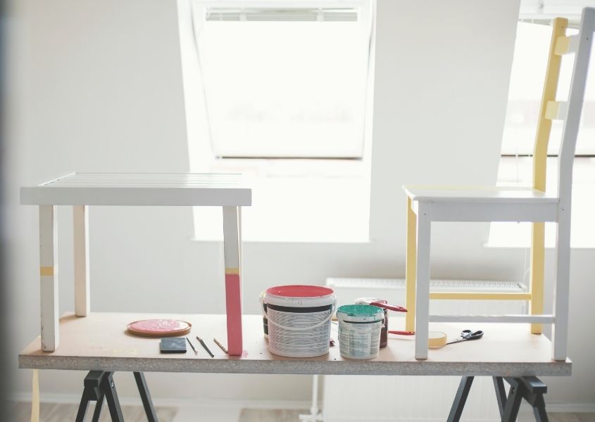 wooden chairs being painted and upcycled