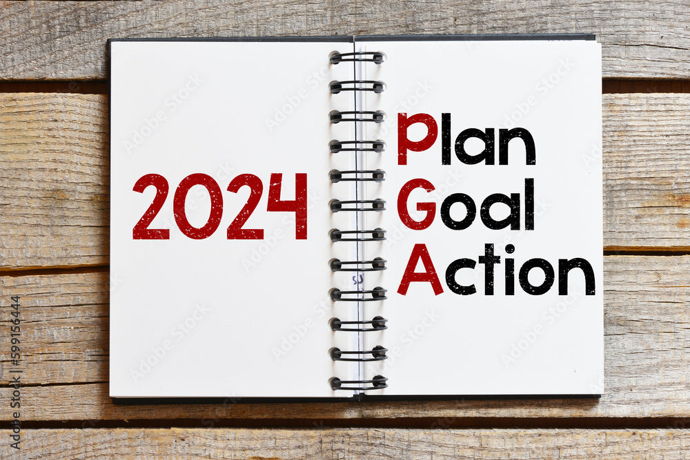 Page from a spiral notepad with large numbers 2021 and plan