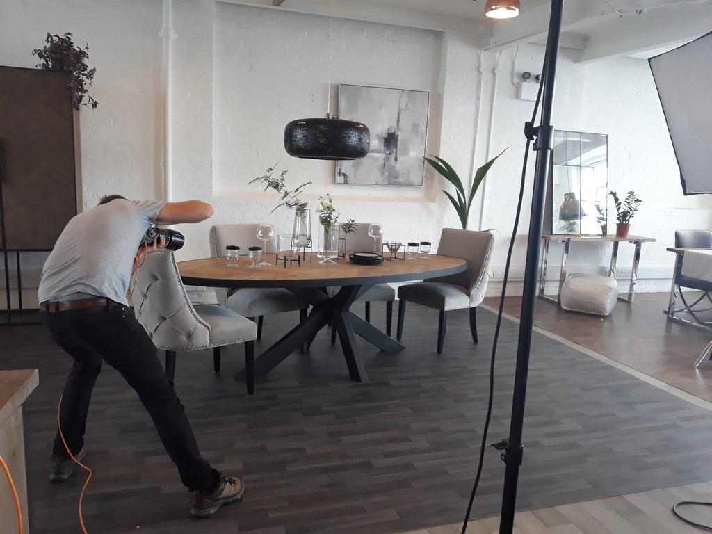 Our Sussex Oak Parquet Industrial Oval Dining Table having its closeup taken by our photographer.