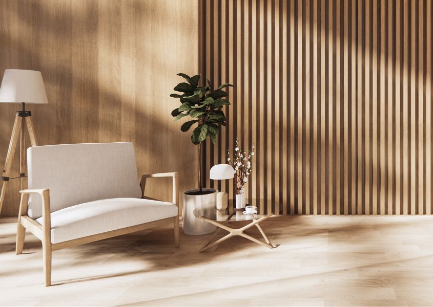 rustic living room with modern wood panelling and cream armchair