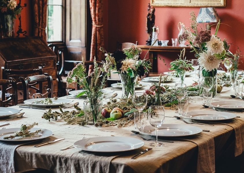 flowers set on a large dining table