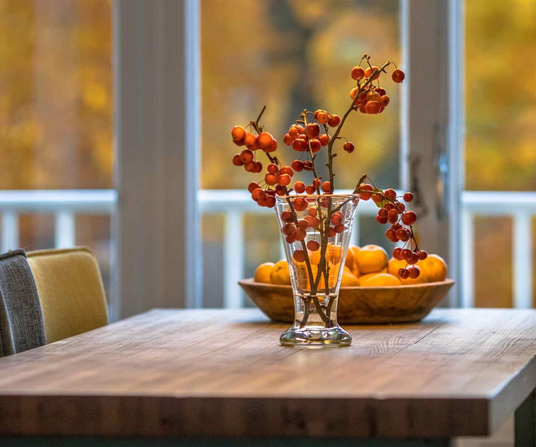 Wooden table with base and red berries