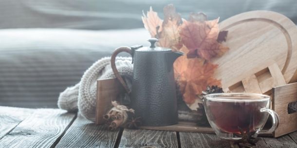 Tall black teapot with coffee in glass drink