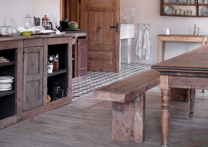 Farmhouse style dining room with large wooden sideboard and rustic dining bench