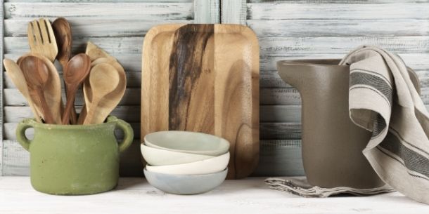 Selection of wooden kitchen utensils including wooden board