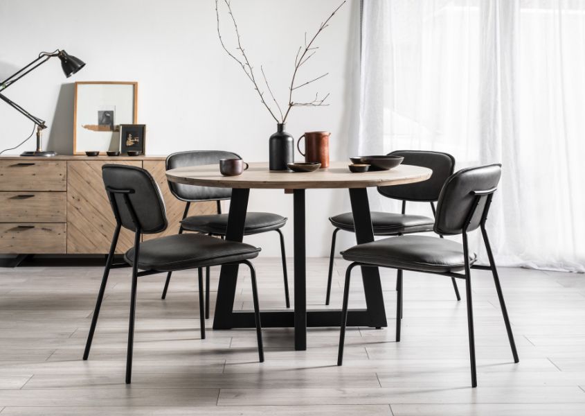 reclaimed wood round dining table with grey faux leather dining chairs
