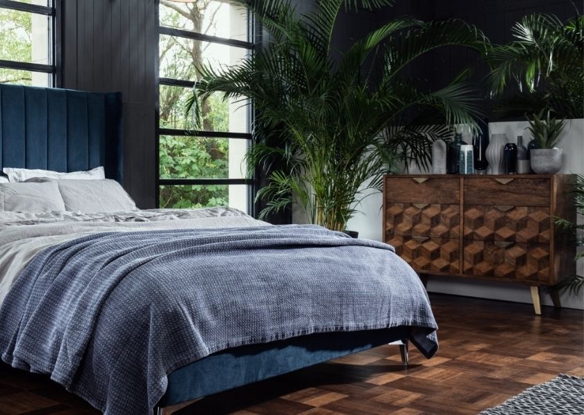 dark bedroom with mango wood chest of drawers