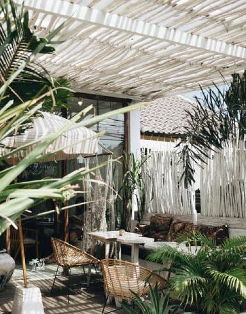 White wooden outdoor roof with bamboo furniture
