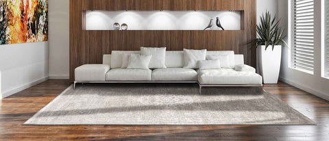 Louis De Poortere Fading World Rug - White Pepper in living room with sofa