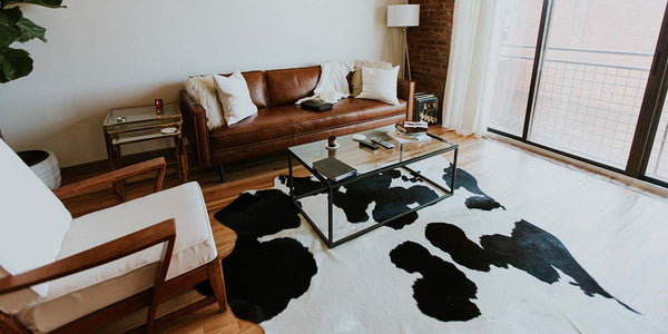 Brown Cerato Leather Sofa in Living Room with Armchair and Coffee Table