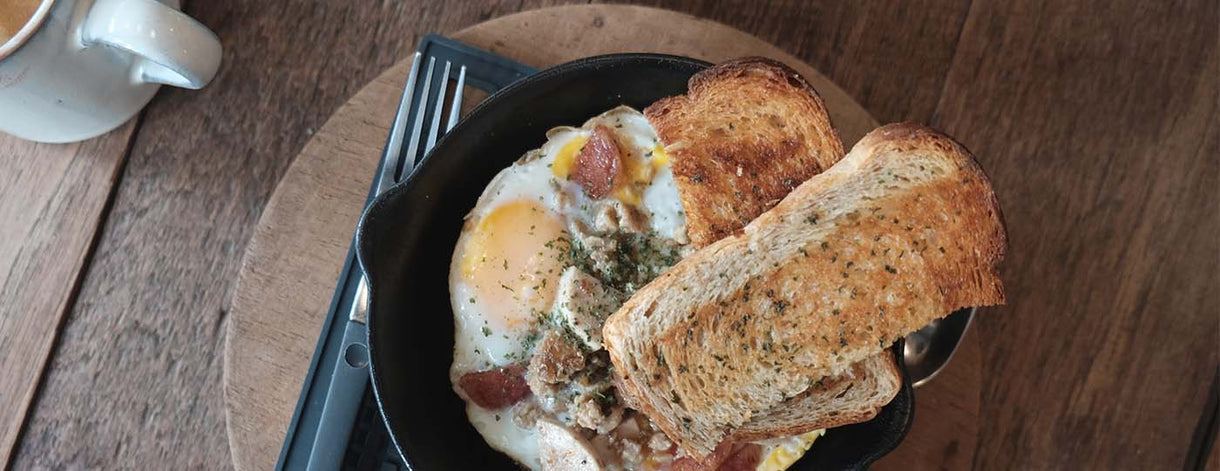 Eggs and Bread on Wooden Dining Table