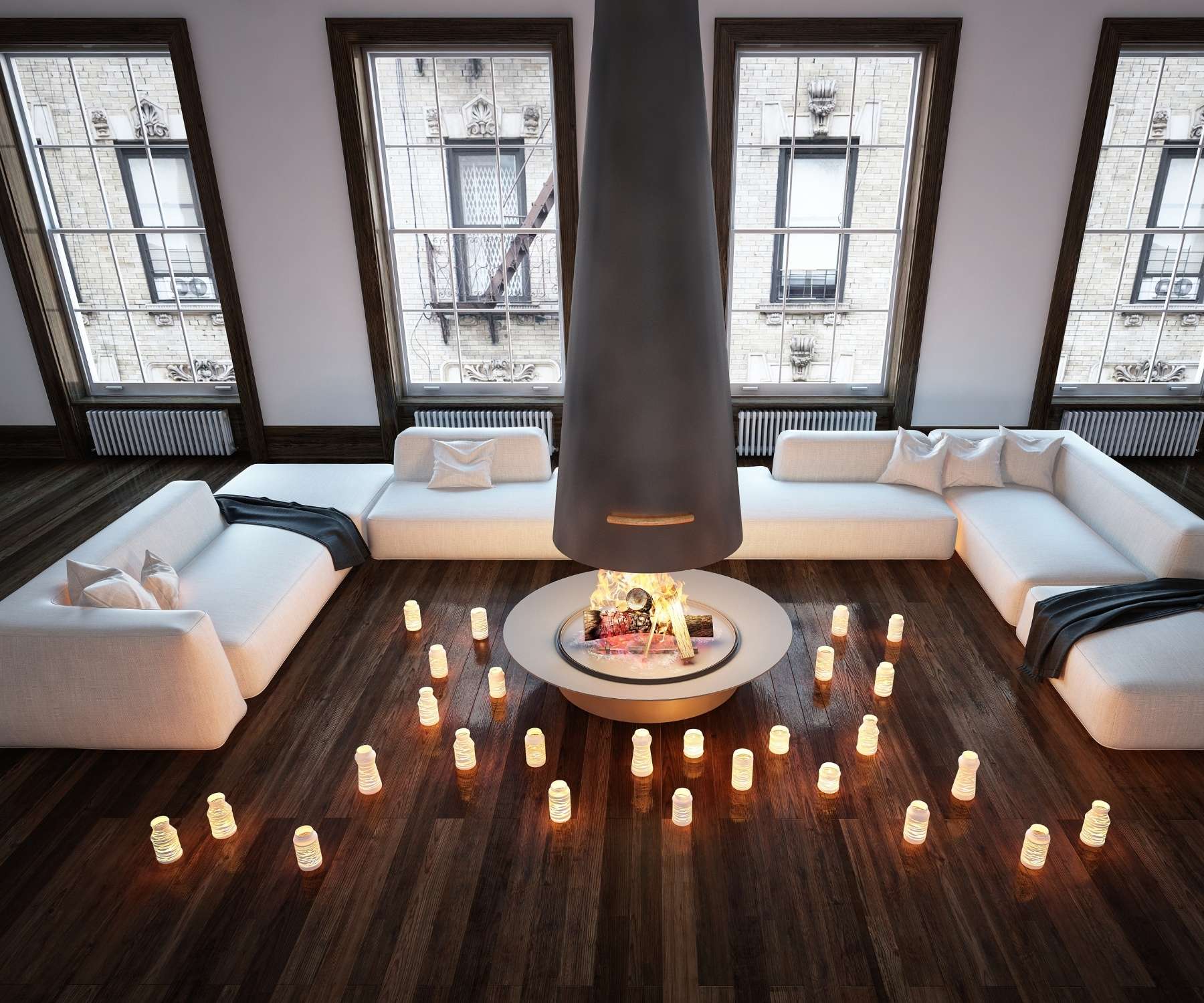 white sofa in living room with candles on the floor