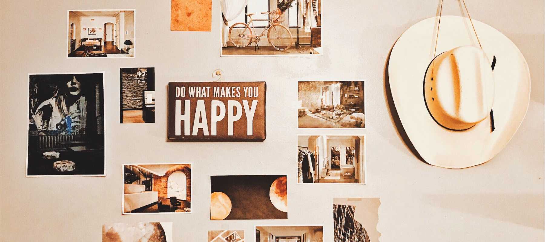 Collection of photographs and a hat on a wall