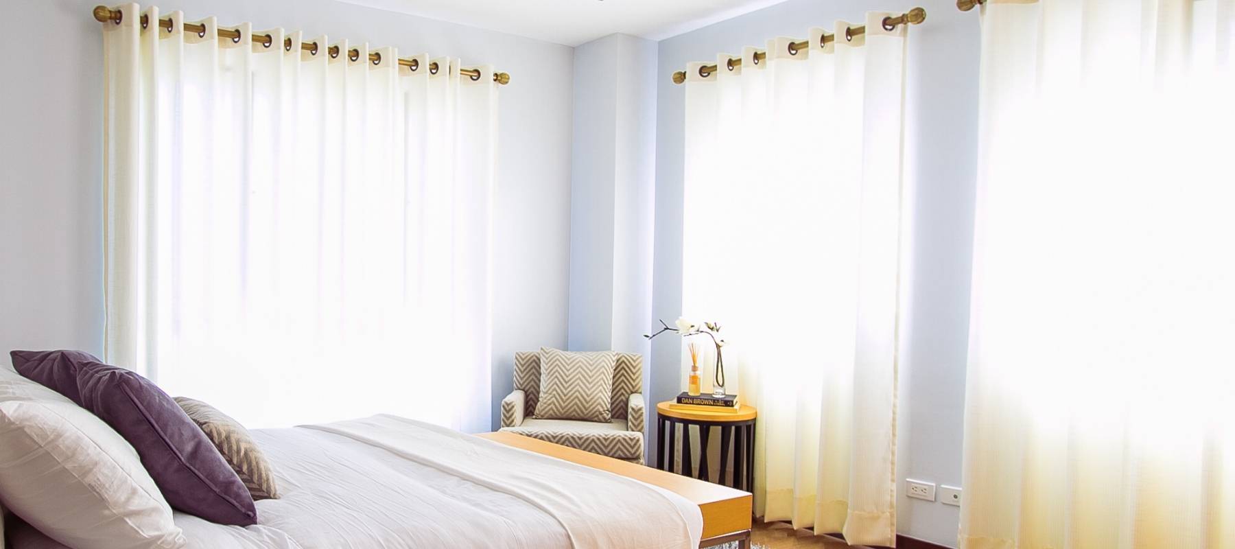 Bright bedroom with white curtains