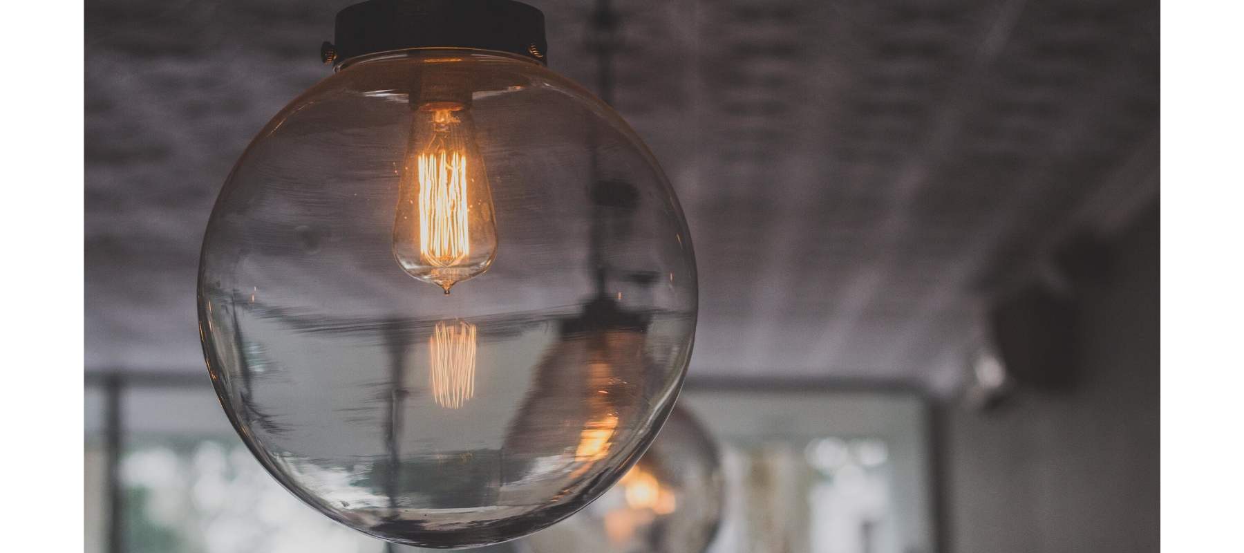 Smoked glass pendant with exposed bulb