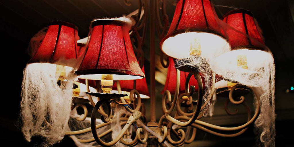 Fake spider web on chandelier