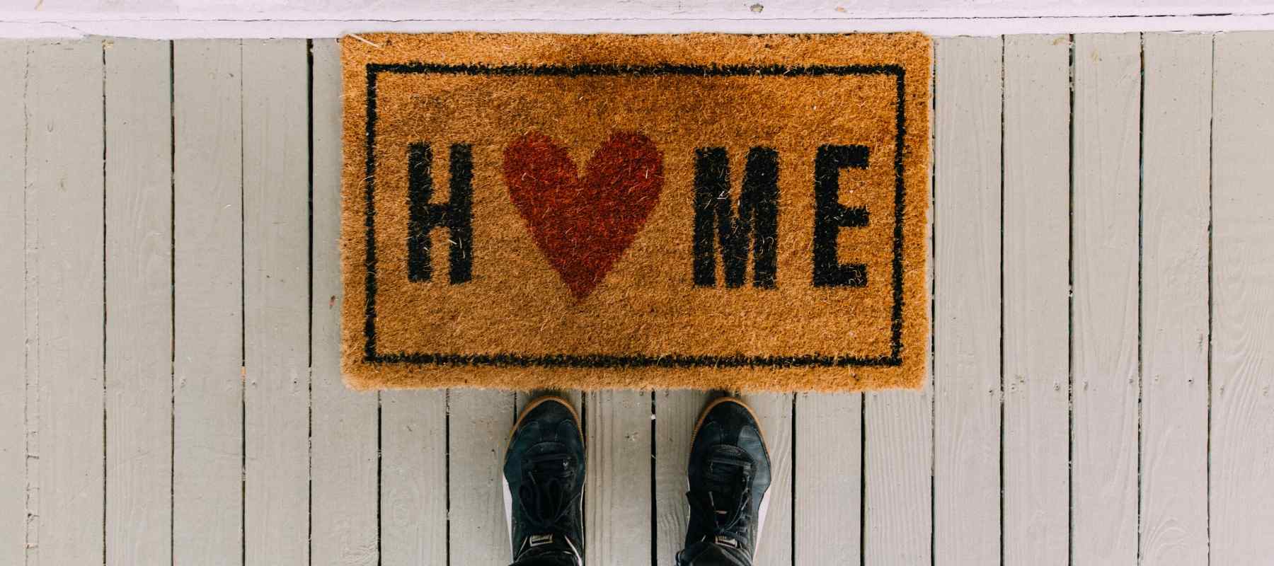 Doormat on a white wood floor