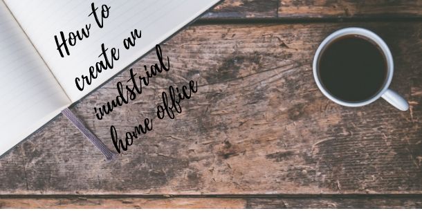 Wooden desk with cup of black copy and notebook
