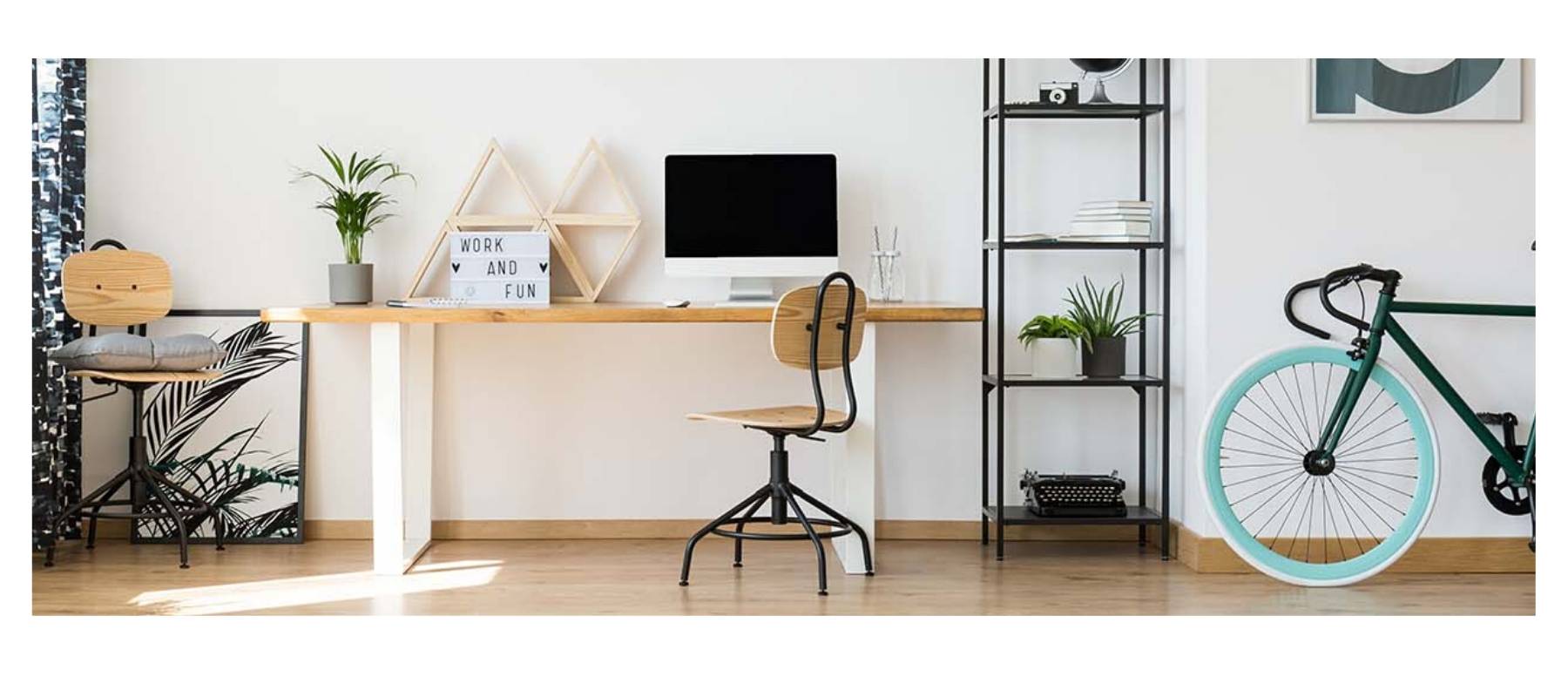 Home office with black steel bookcase and bicycle 