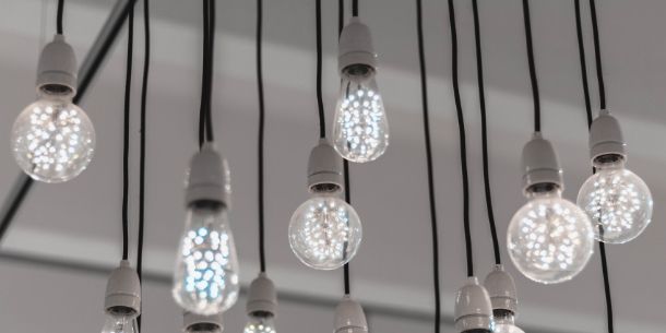 Cluster of bare bulbs hanging from ceiling