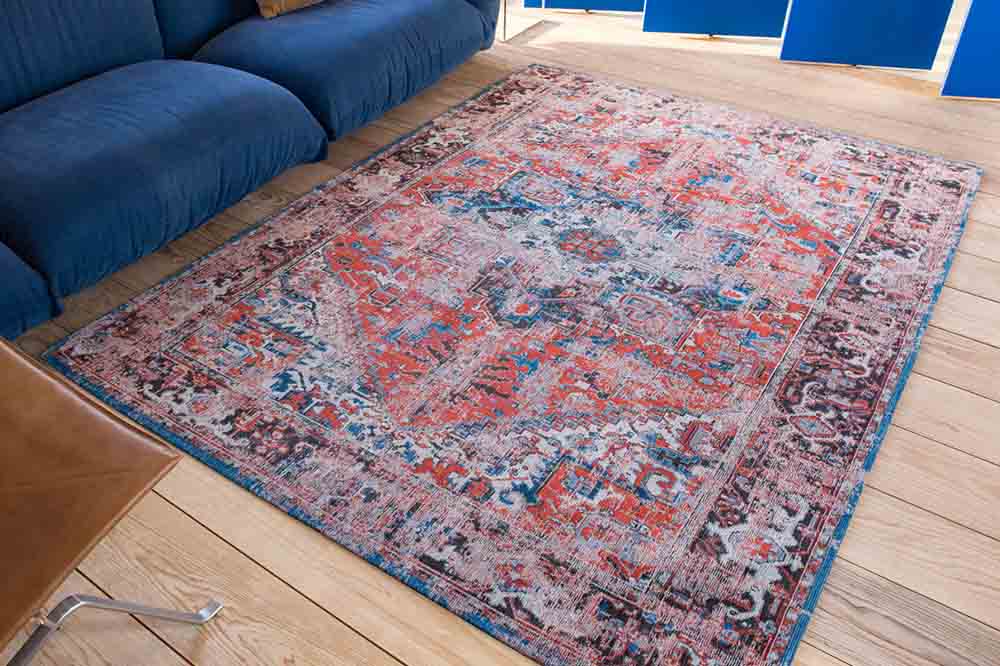 Louis de Poortere Red and Blue Rug in Room