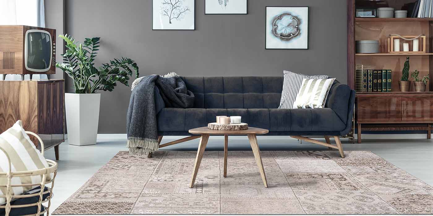 Louis de Poortere Khayma Farrago Lawrence Rug in Living Room with Grey Sofa