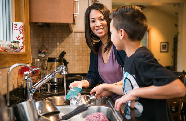 Mother and Child Washing Dishes