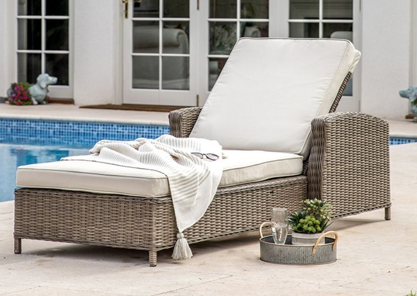 garden sun lounger next to swimming pool