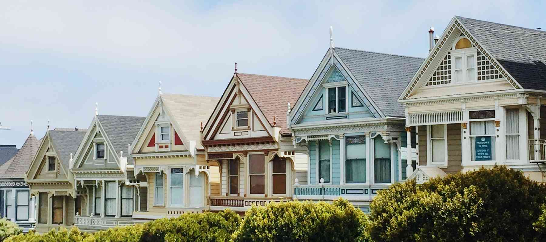 Row of colourful timber framed houses