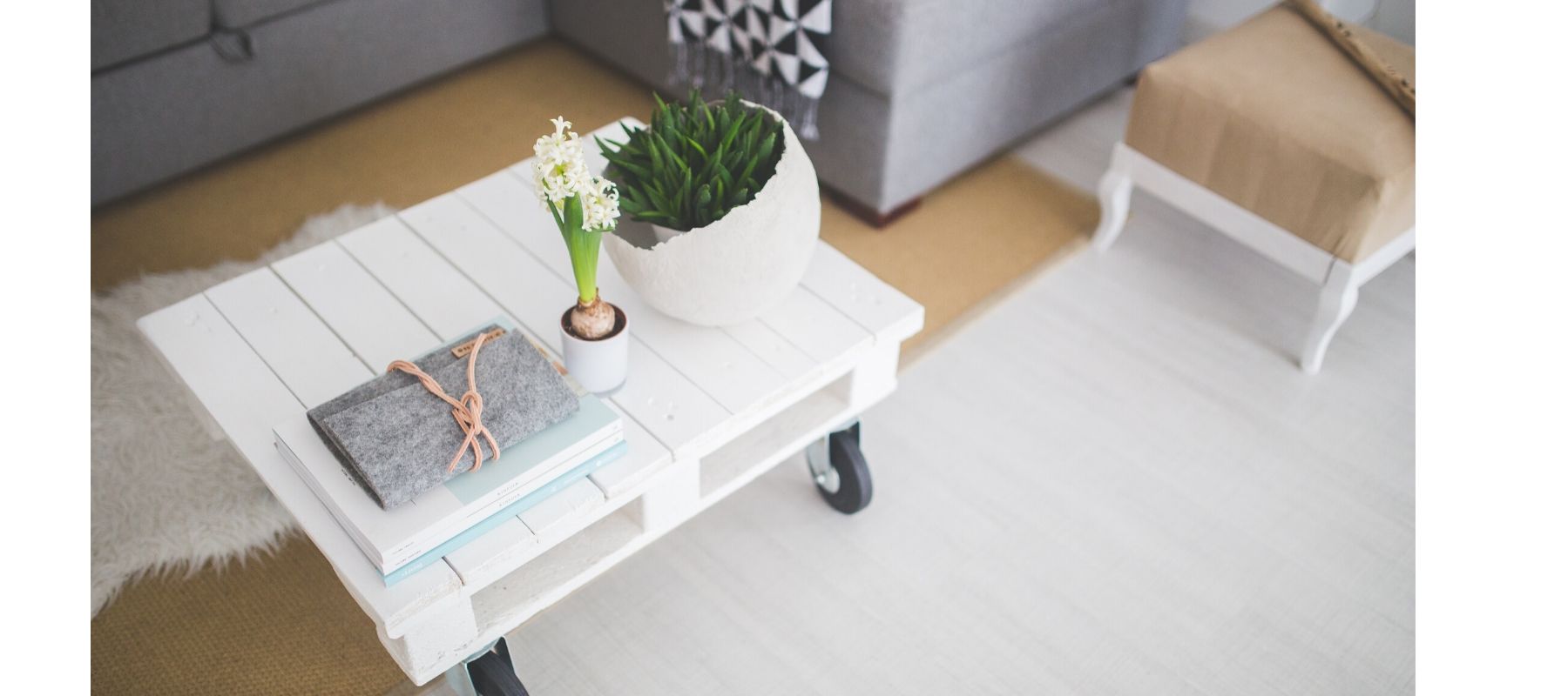 White painted palette with flowers on top