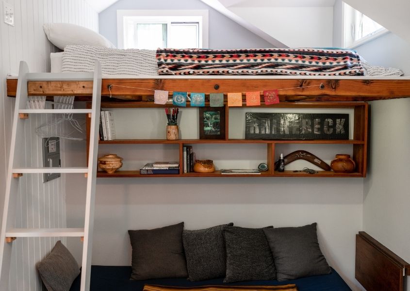 wooden bunk bed with seating area