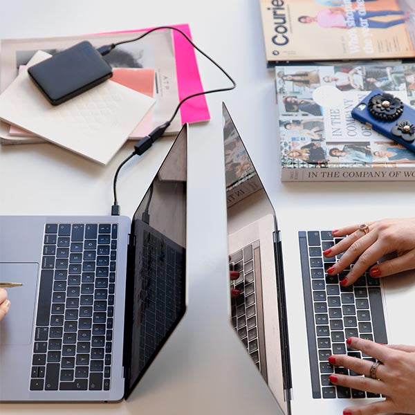Two Laptops on Desk
