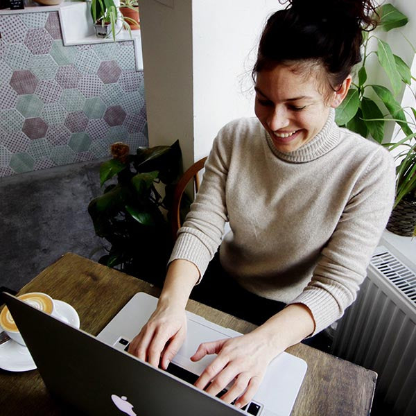 Woman Working on Reclaimed Wood Desk