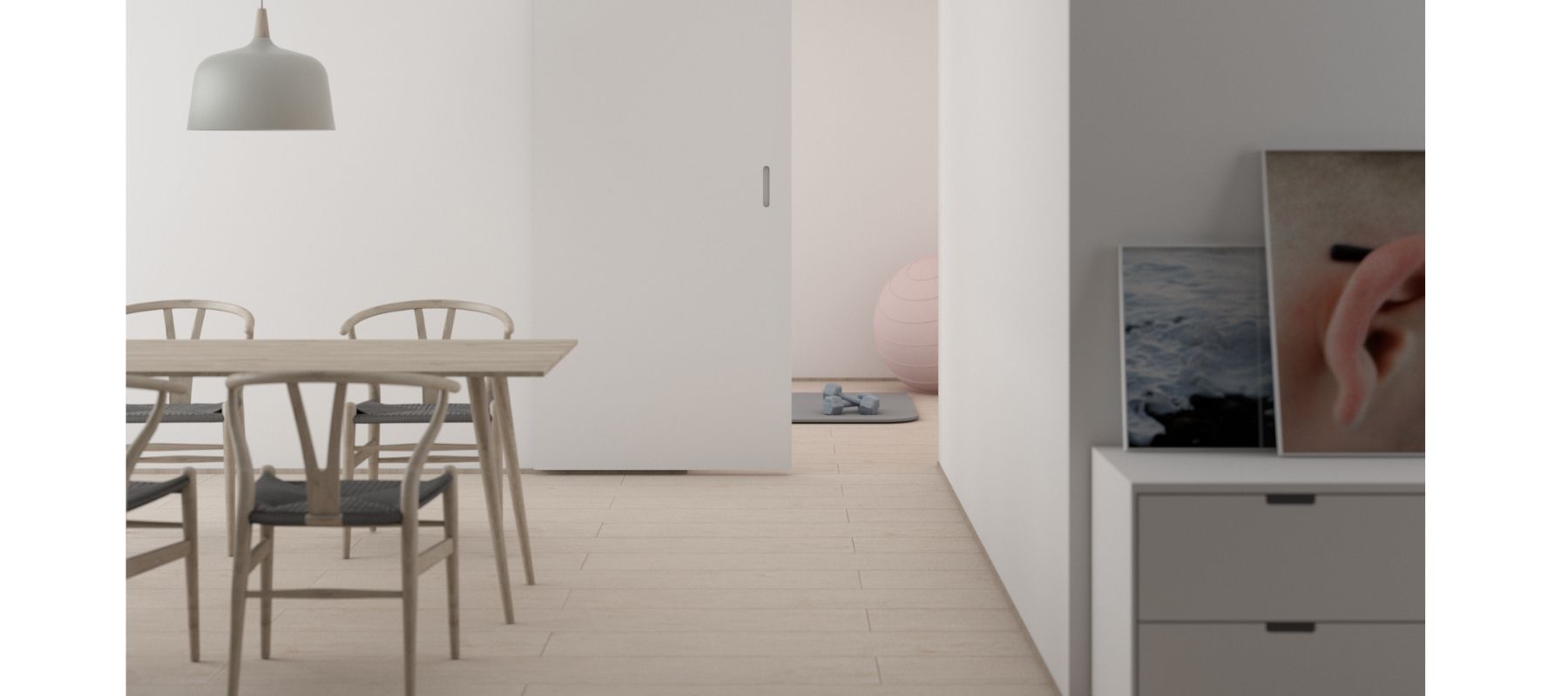 Pale wood dining table with white hanging pendant light