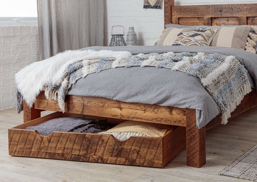 Wooden under drawer storage under reclaimed wood bed