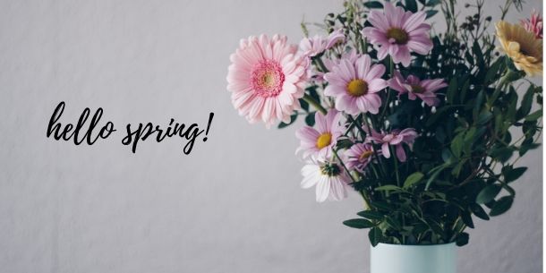 Bunch of pink flowers in white jar