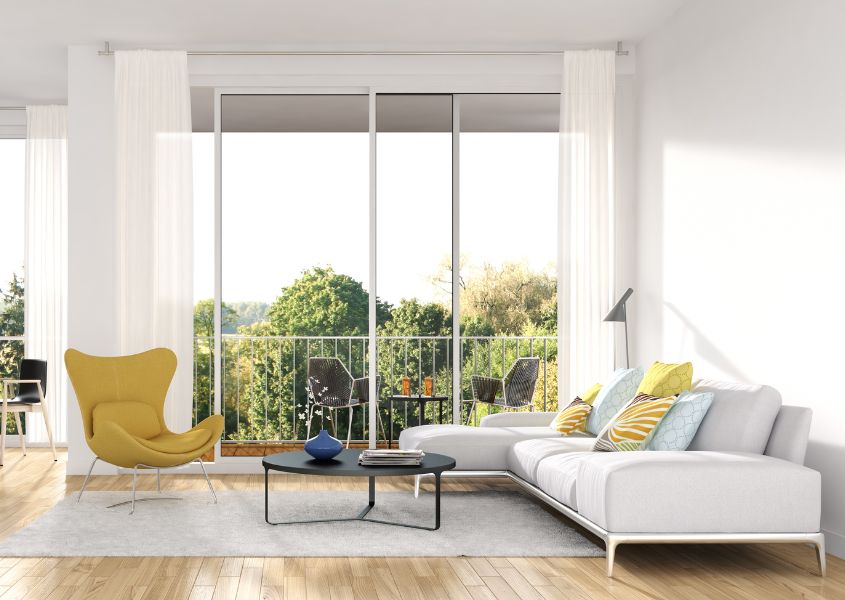 modern white sofa with yellow armchair