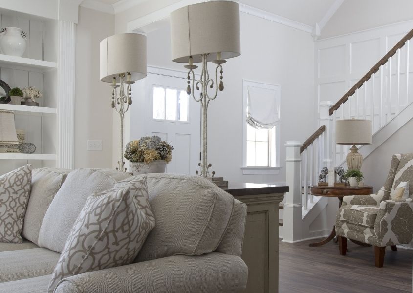 white living room with white sofa and table lamp