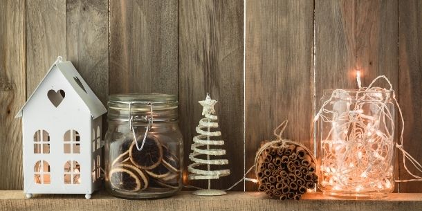 Collection of Christmas ornaments against rustic wood background
