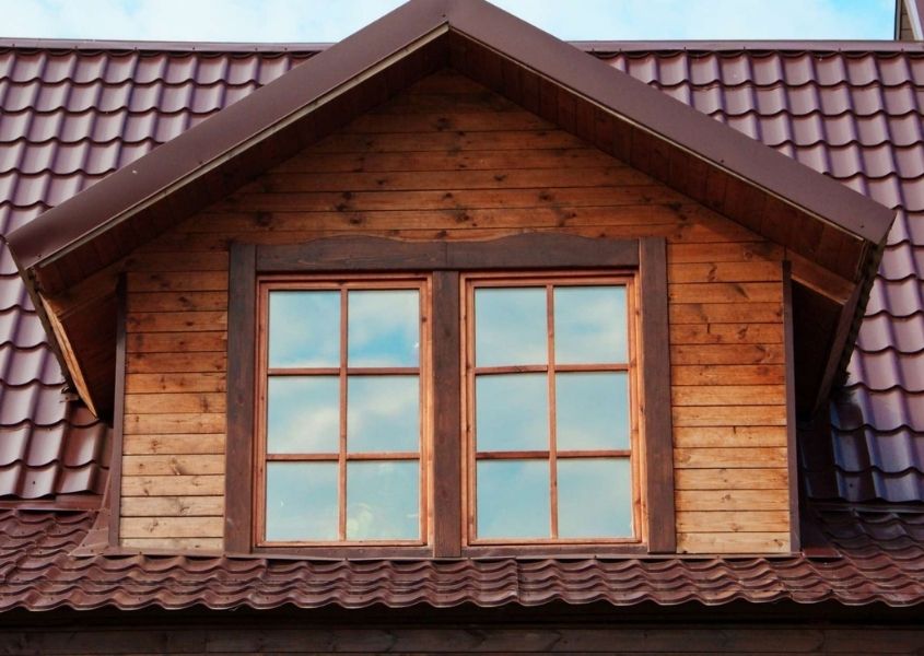 Dorner window with two paned windows and red tiled roof