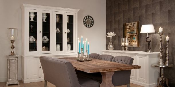 Dining room with large white glass dresser and sideboard and reclaimed wood dining table