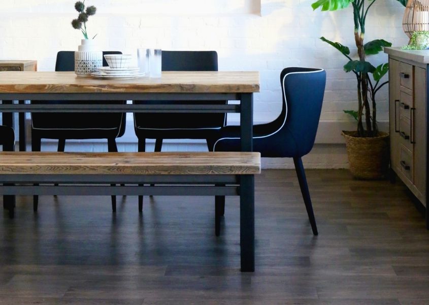 industrial dining table with black fabric dining chairs