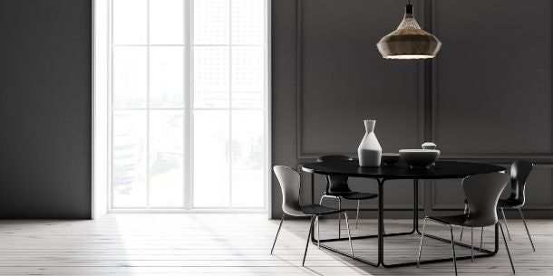 Dark dining room with black dining room table