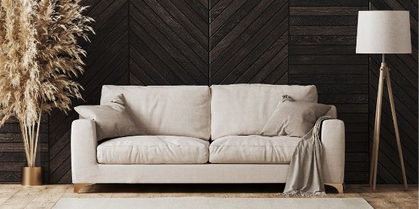 white fabric sofa with large pampas grass