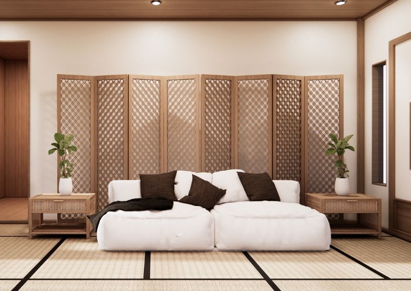 calming living room with white sofa and wooden side tables