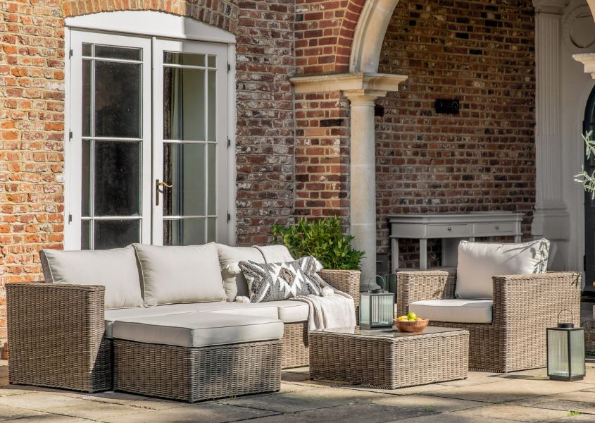 rattan garden sofa set with white cushions