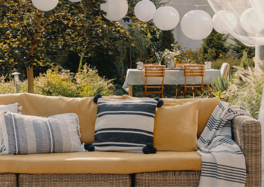 garden sofa set with yellow and blue cushions