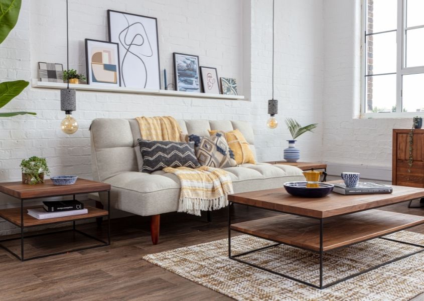 grey sofa bed with industrial coffee table and square side table