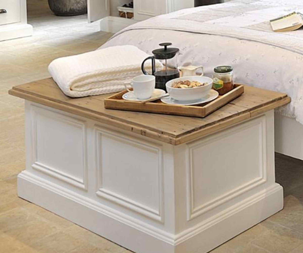 White reclaimed wood blanket box with coffee cup and towels