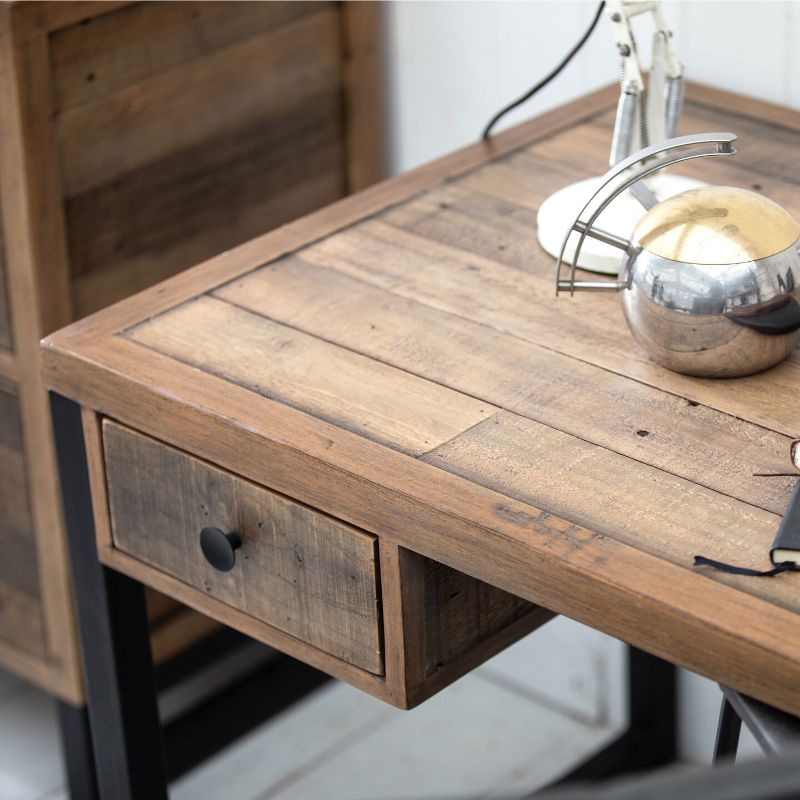 Close up of corner of reclaimed wood desk with drawer